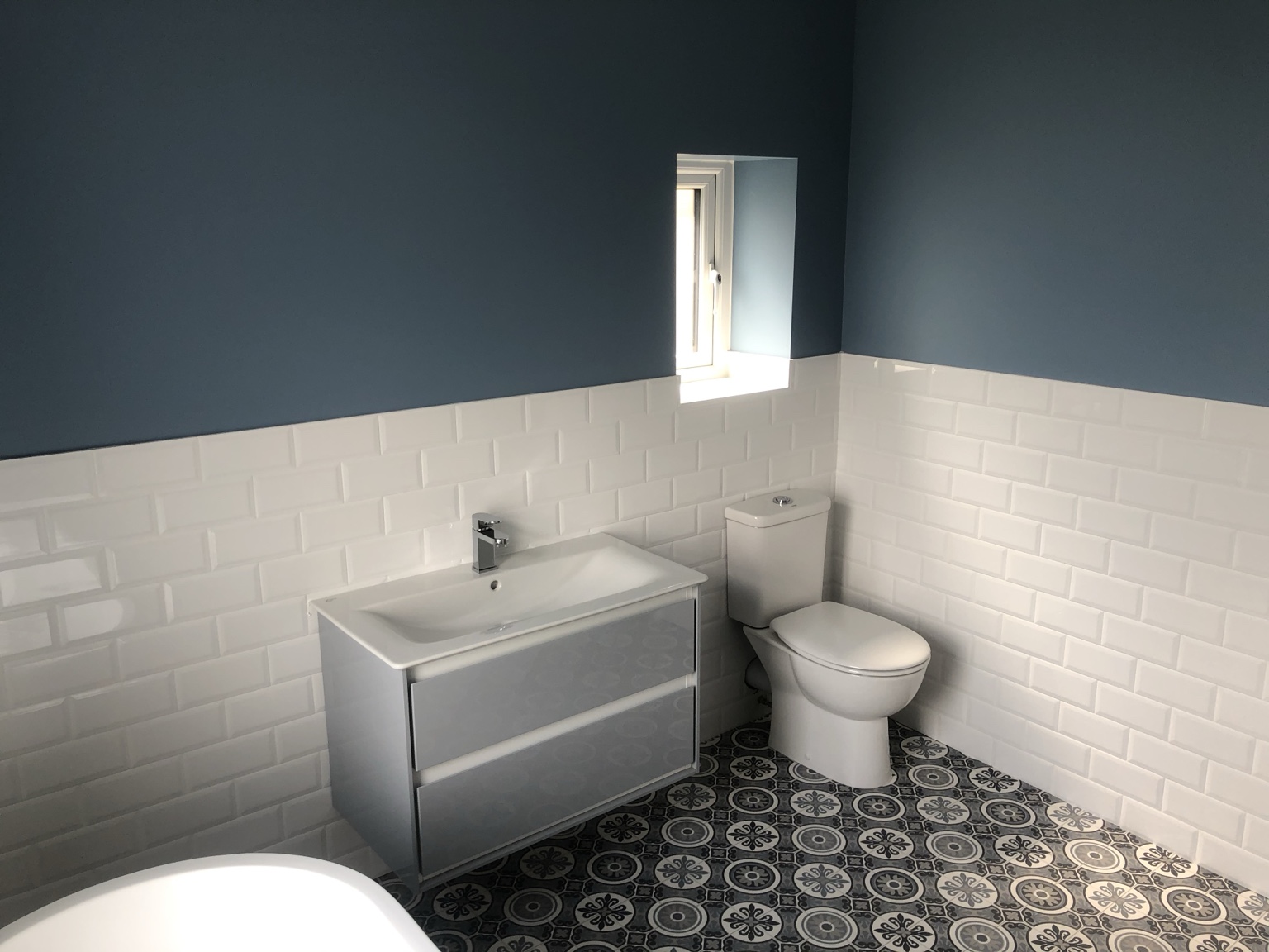 Blue and white patterned bathroom by JMB Plumbing & Heating